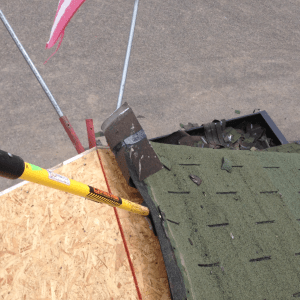 Special shovels were used to scrape off all of the old shingles and remove all the old nails from the large two-storey structure.