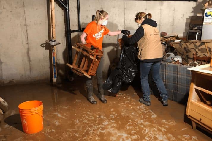 Samaritan's Purse team leaders and volunteers removed damaged possessions from a flooded basement in New Brunswick.