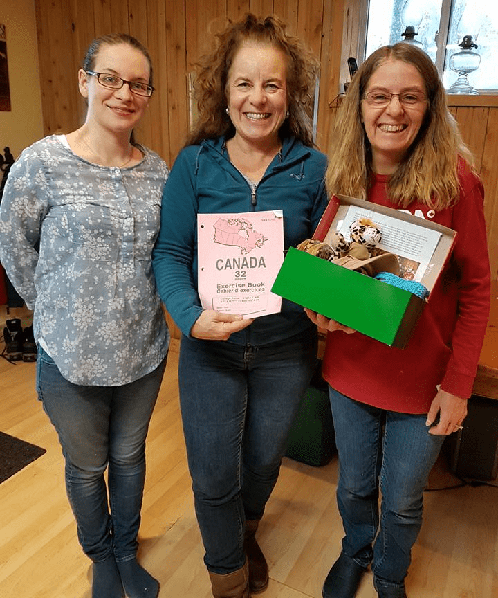 Gloria (far right) at a shoebox packing party with her friends.