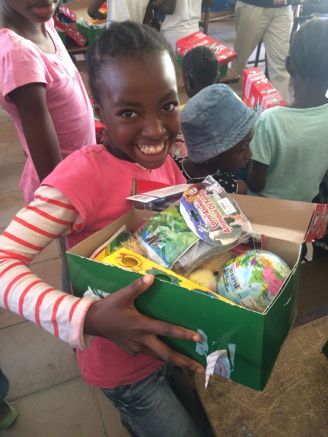 This little girl loved the items that were lovingly packed in her shoebox.