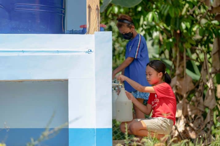 Abby gets water from the large BioSand Water Filter now installed at her school. The filter meets the daily safe water needs of over 300 staff, students, and community members.
