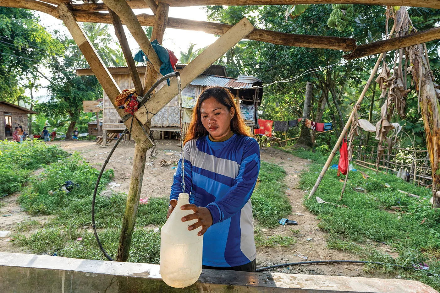Katrina in her community after receiving access to safe clean water through a water project.