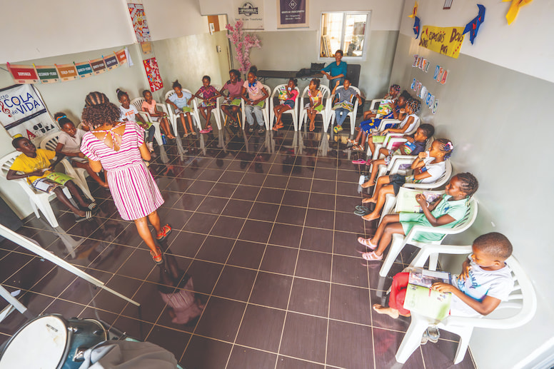 Children praying in a classroom in Cape Verde.
