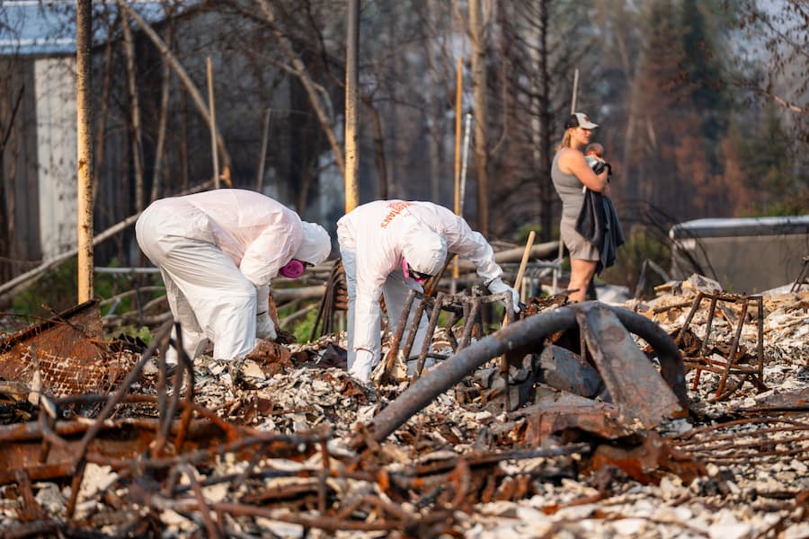 Volunteers sifting through ash