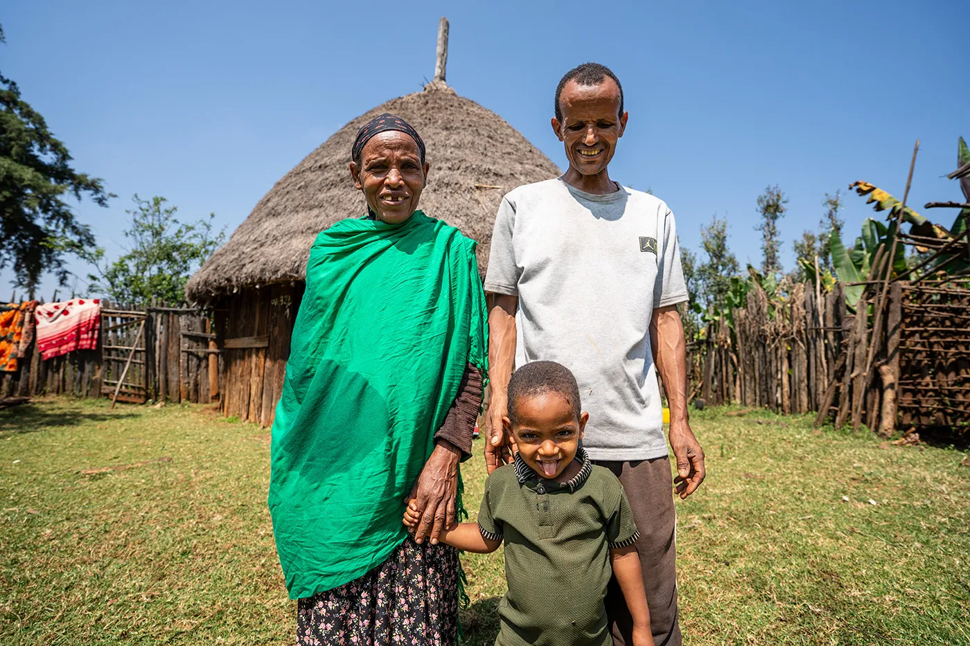 Gimbaru sharing the blessing of a household water filter with neighbours in his community.