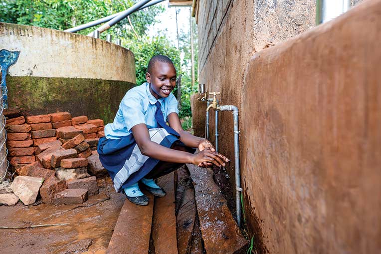 Ivene experiences God's love through safe water provided by Samaritan's Purse.