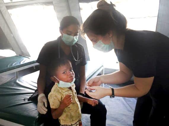 Canadian nurse Sharla Boody cares for a young patient in Bangladesh.