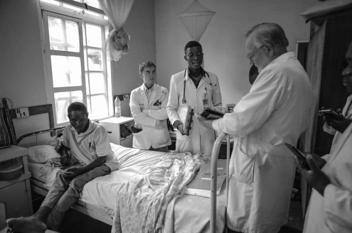 A student in the Christian Internal Medicine Specialization Program at Mbingo Baptist Hospital shares his findings with Program Director Dr. Dennis Palmer.