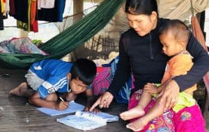 Samay and Chea working hard on Samay’s reading and writing.