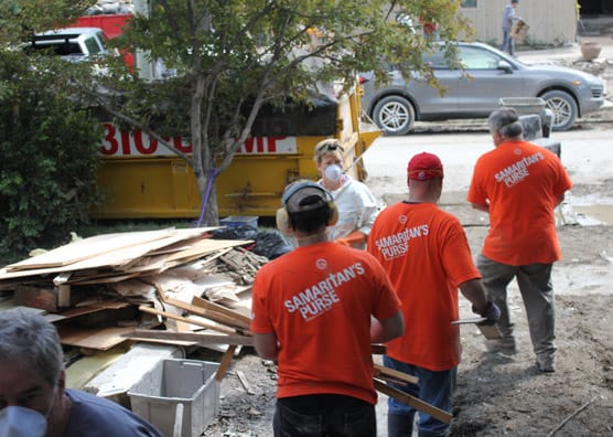 Volunteers hauling items