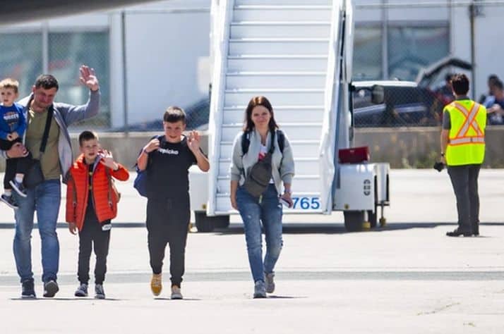 Roman and Olha Koval, and their three sons, Oleh, 11, Taras, 7, and Yurii, 3, are among 28 people fleeing the war from Ukraine, arriving at a terminal at Toronto Pearson International Airport on a plane from Poland, operated by Samaritan’s Purse Canada on Sunday May 15, 2022. PHOTO BY ERNEST DOROSZUK /TORONTO SUN