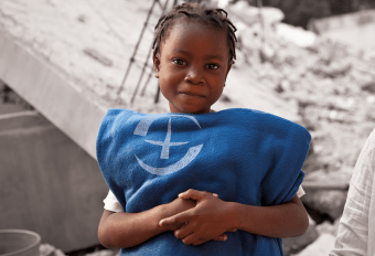Girl holding blanket