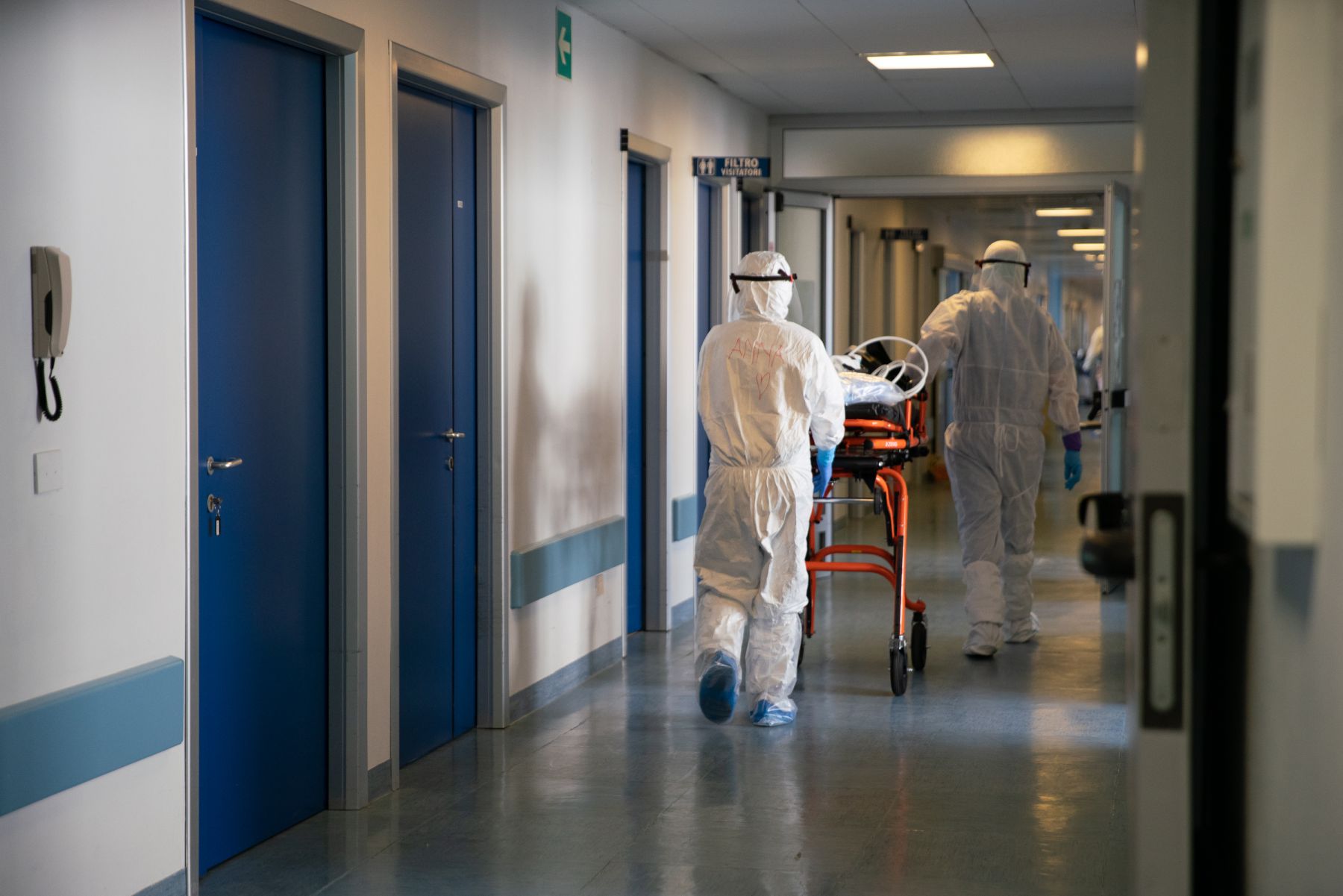 Writing their names on their personal protective equipment is one way to break the barrier it creates between medical staff and patient.