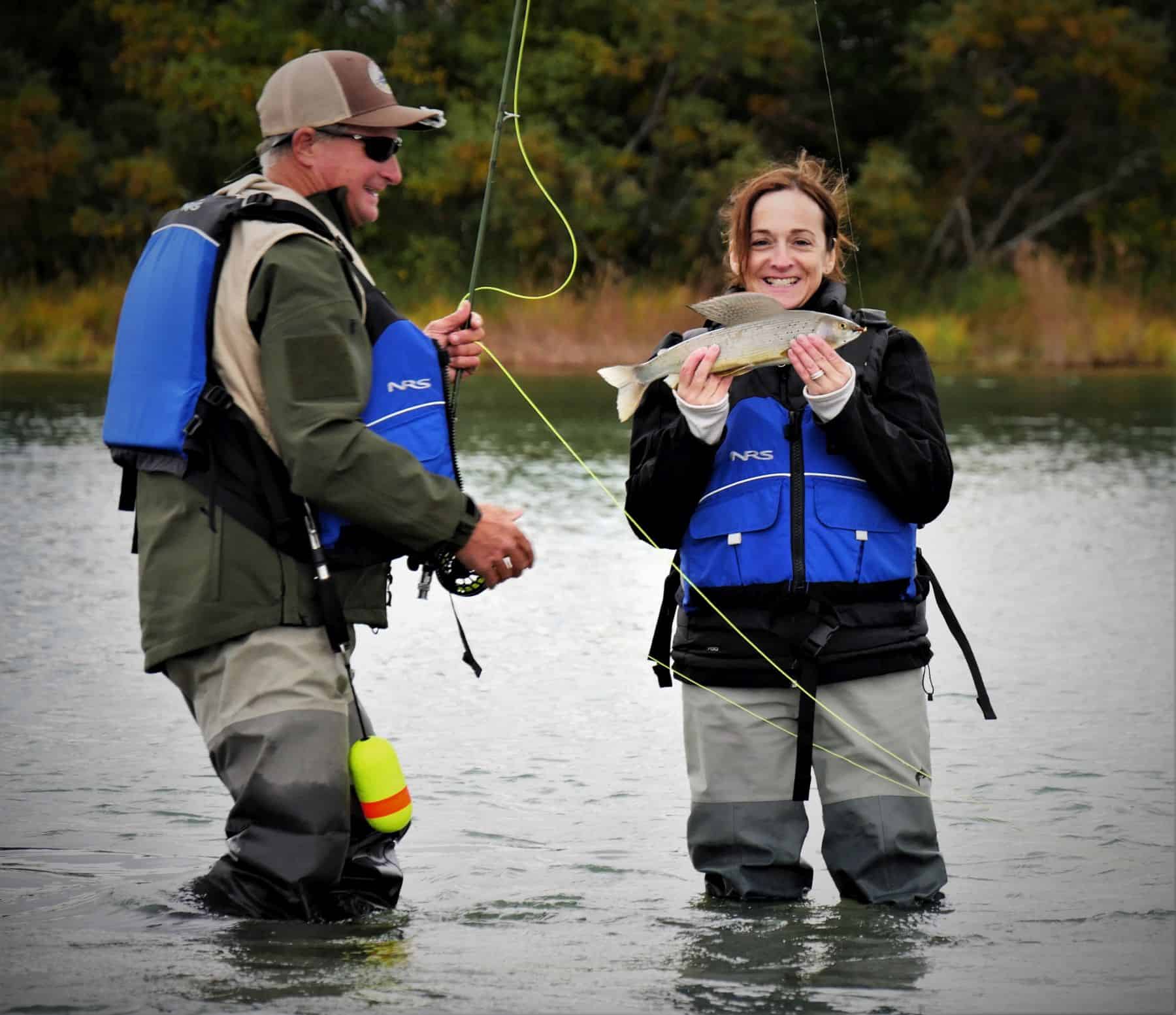 Carole was excited to catch one of her many fish-including large salmon-after a day of learning how to fly with her husband Quinn and encouraging Operation Heal Our Patriots guides.