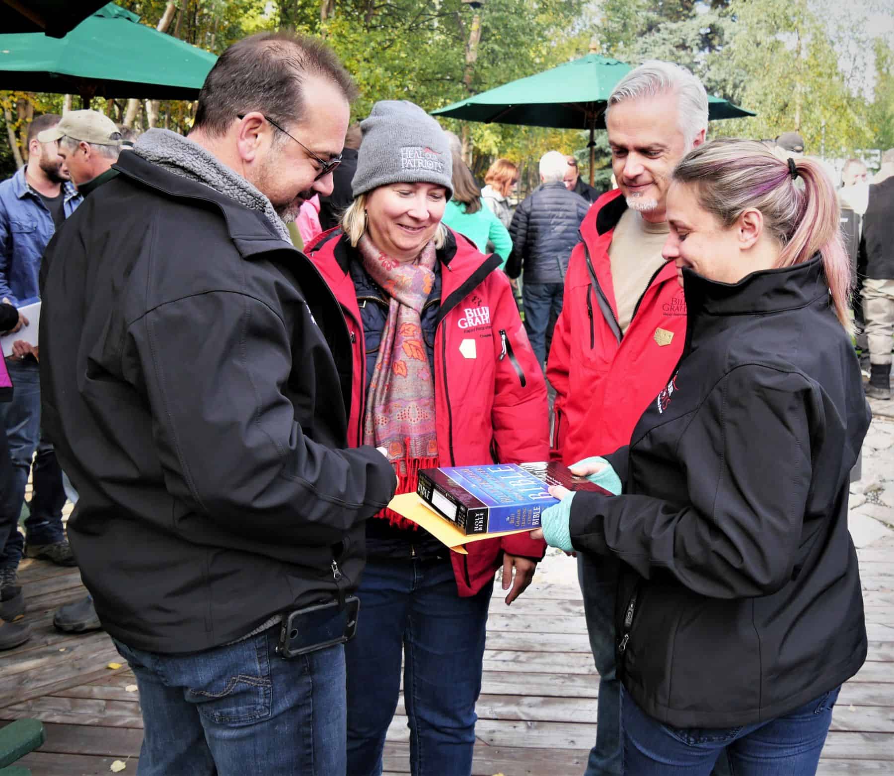 Canadian chaplains Irene and Laurent Trabadello presented Bibles signed by Franklin Graham and Operation Heal Our Patriots staff to couples at the end of the week in Port Alsworth, Alaska.