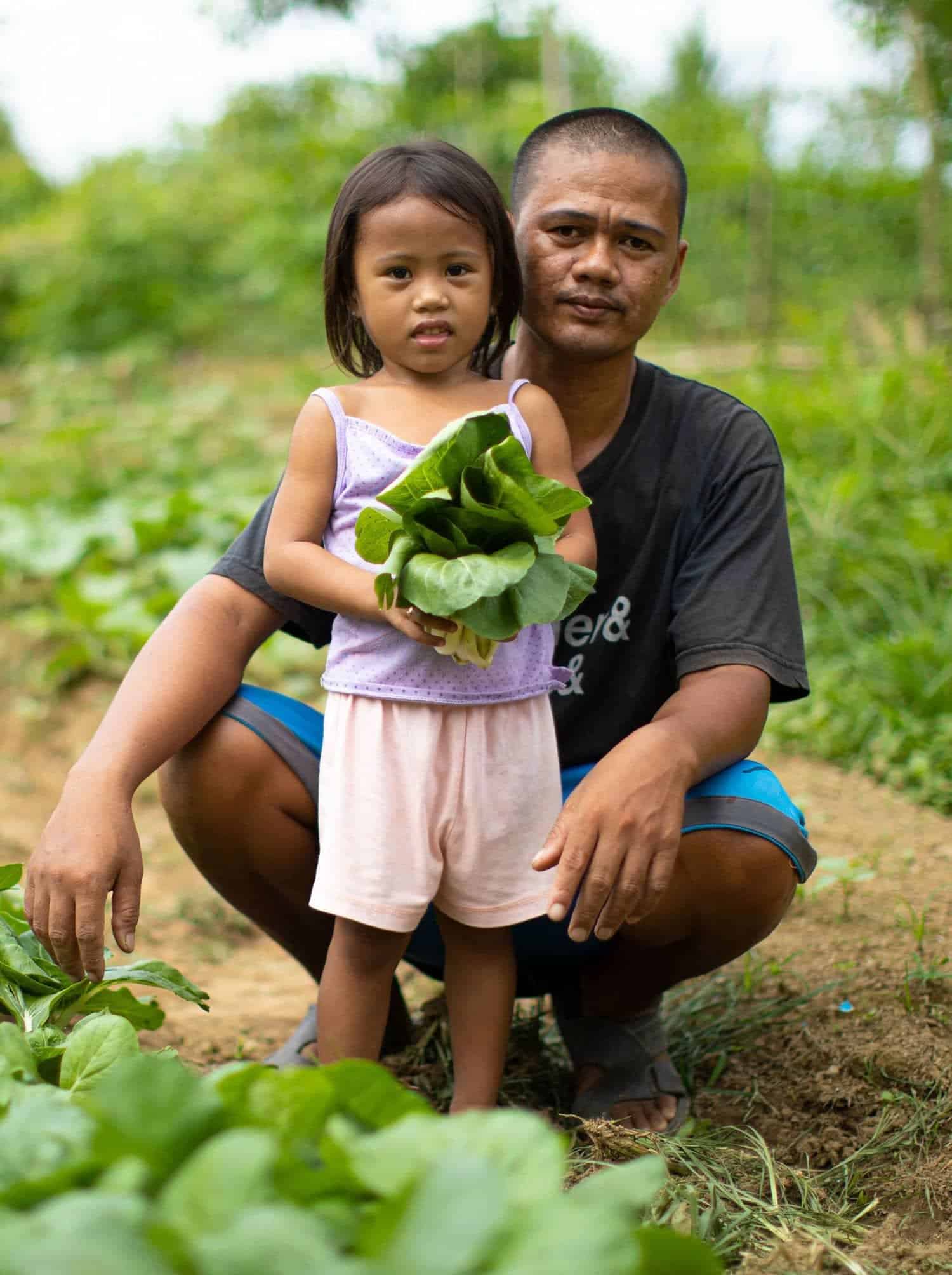 grow-hope-child-with-father-in-garden