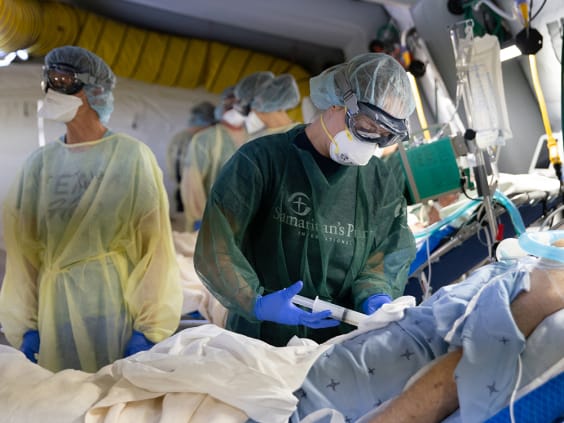 Medical staff attend to a COVID-19 patient at the Samaritan’s Purse Emergency Field Hospital in Cremona, Italy, in March.