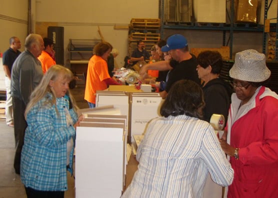 Volunteers packing hygiene kits