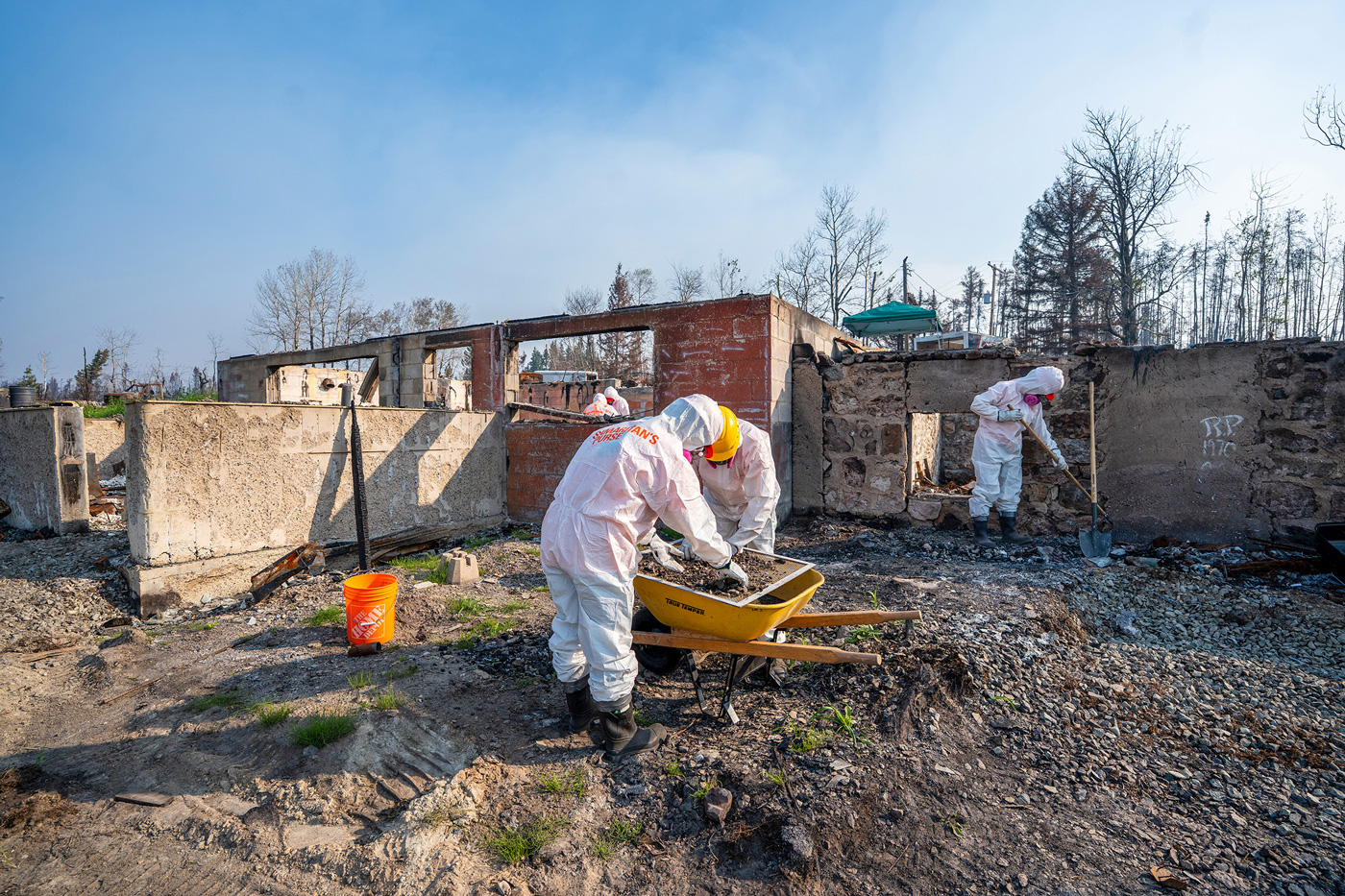 Volunteers prayerfully sift through ashes to find rings and
other treasured keepsakes, which can help families find
closure and glimpse how much God cares for them.